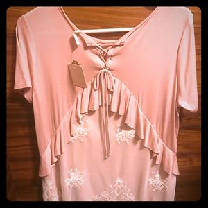 Ballet pink top with lace back.